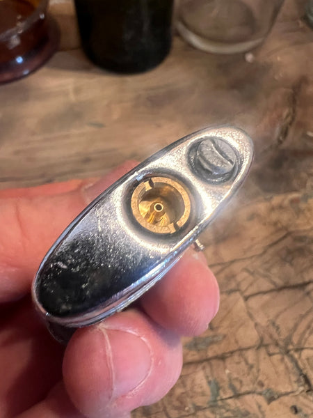 Briquet vintage en métal en forme de boule de pétanque