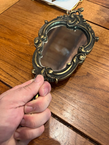 Miroir face à main vintage en bronze