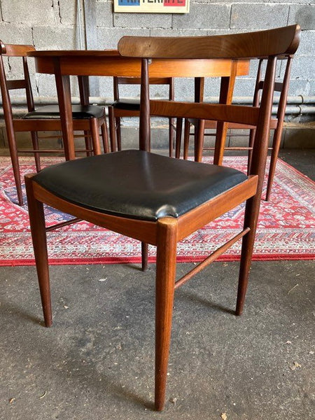 Ensemble scandinave table ronde placage teck à rallonges et 4 chaises - Années 60