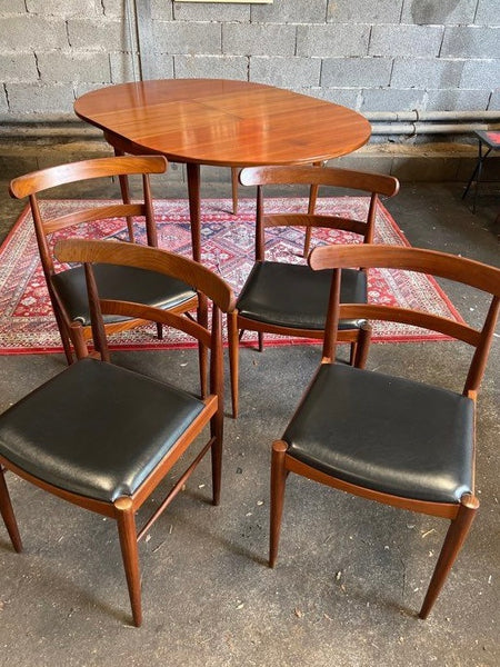 Ensemble scandinave table ronde placage teck à rallonges et 4 chaises - Années 60