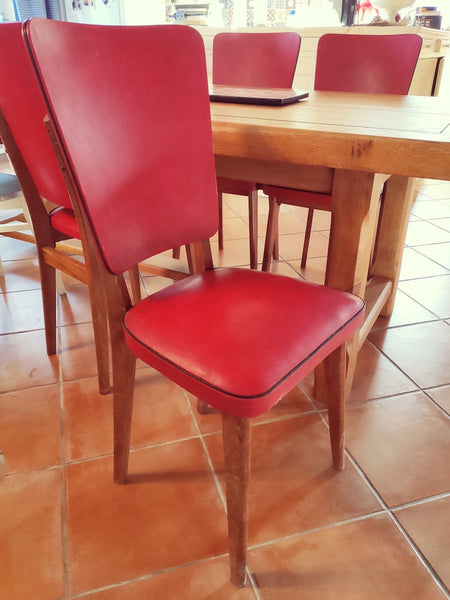 Ensemble de 4 chaises vintages en skaï rouge et bois - Le Sélectionneur - Brocante en ligne