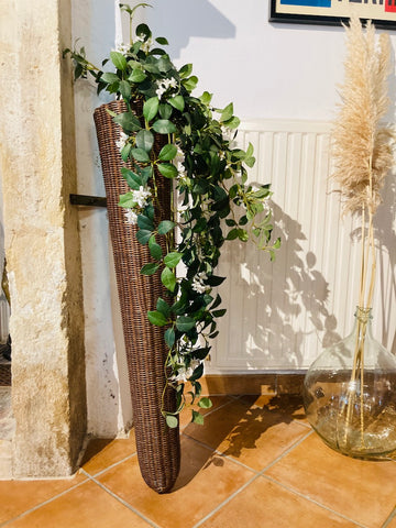 Long porte plante vintage en osier
